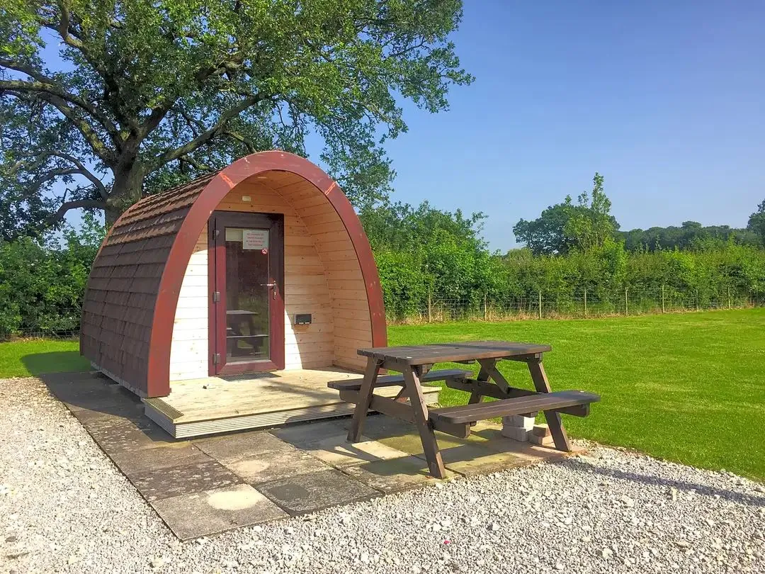 Heated camping pod with decking and picnic bench at Wagtail Park, York