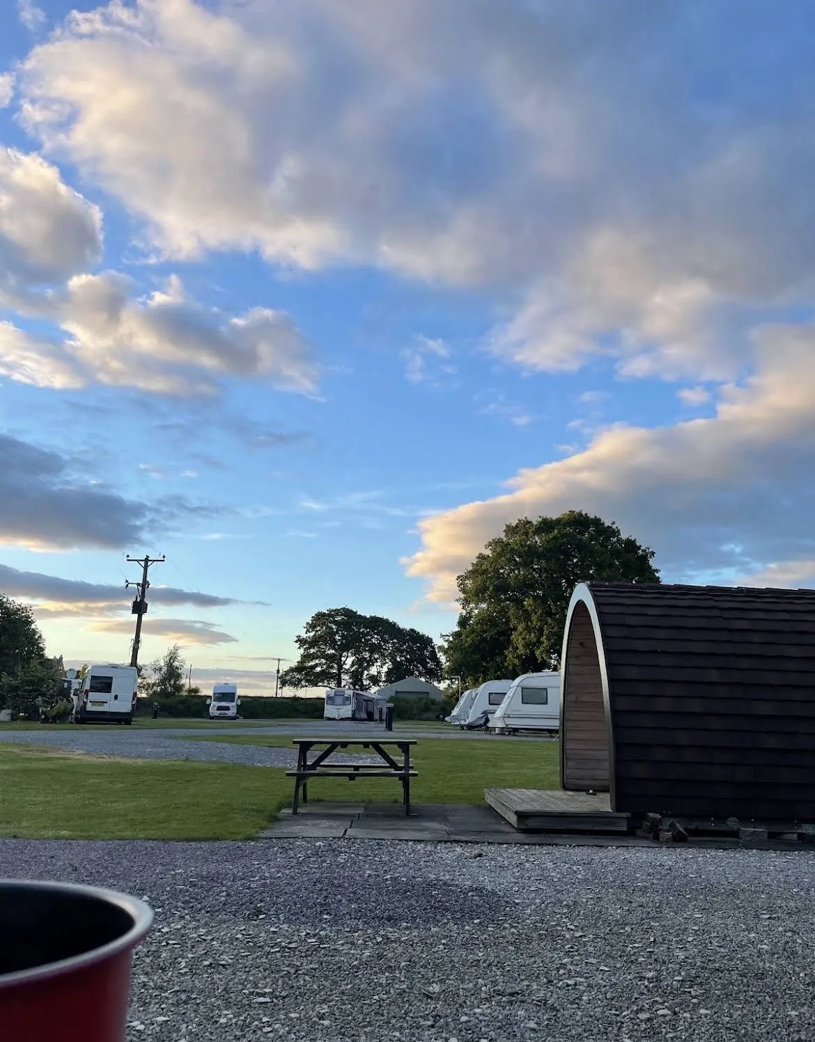 Wide gravel access track between touring caravans at Wagtail Park, York